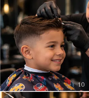 Smiling young boy getting a fresh haircut